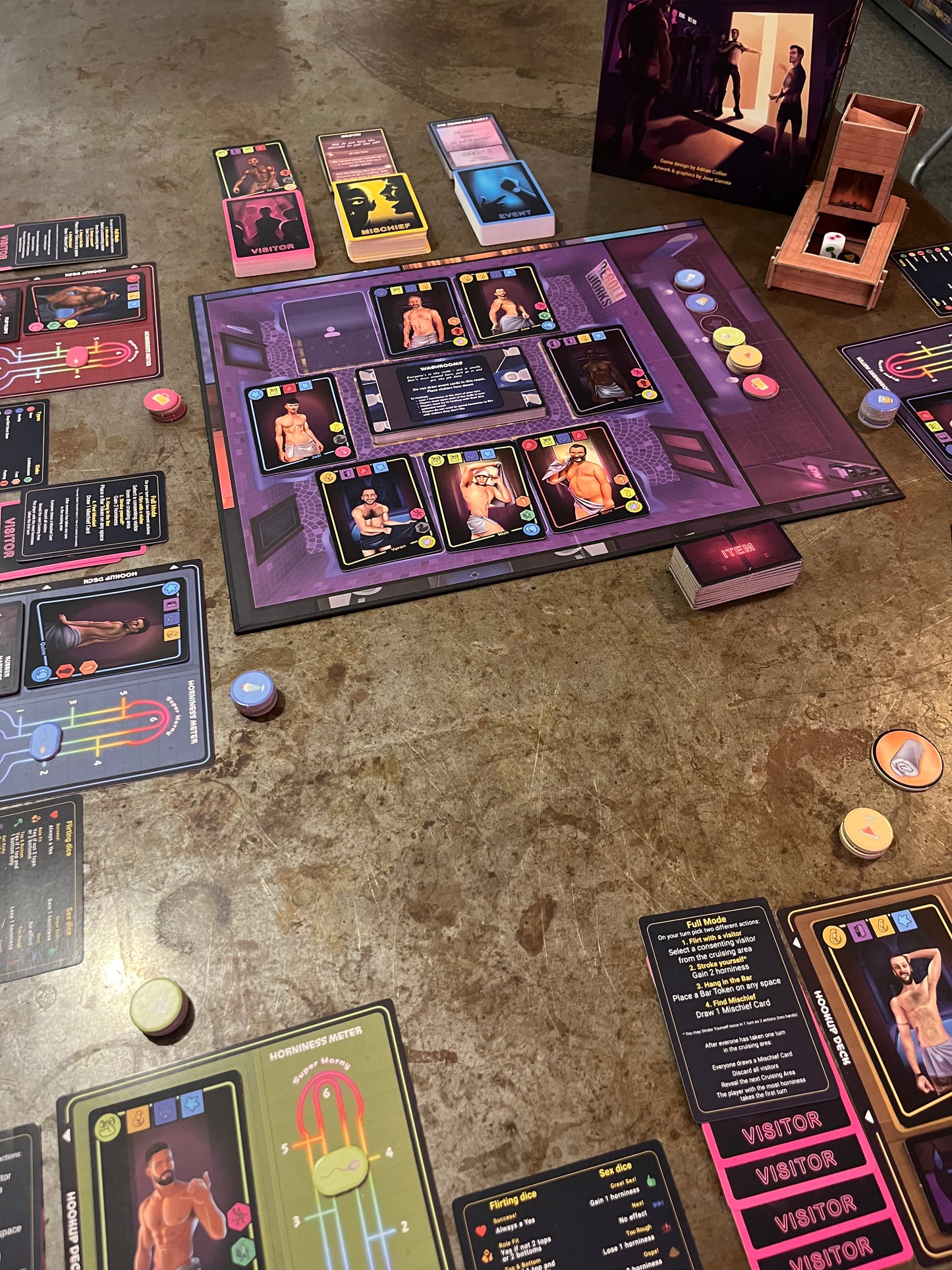 Gay Sauna the Board Game with cards and pieces on a metal table