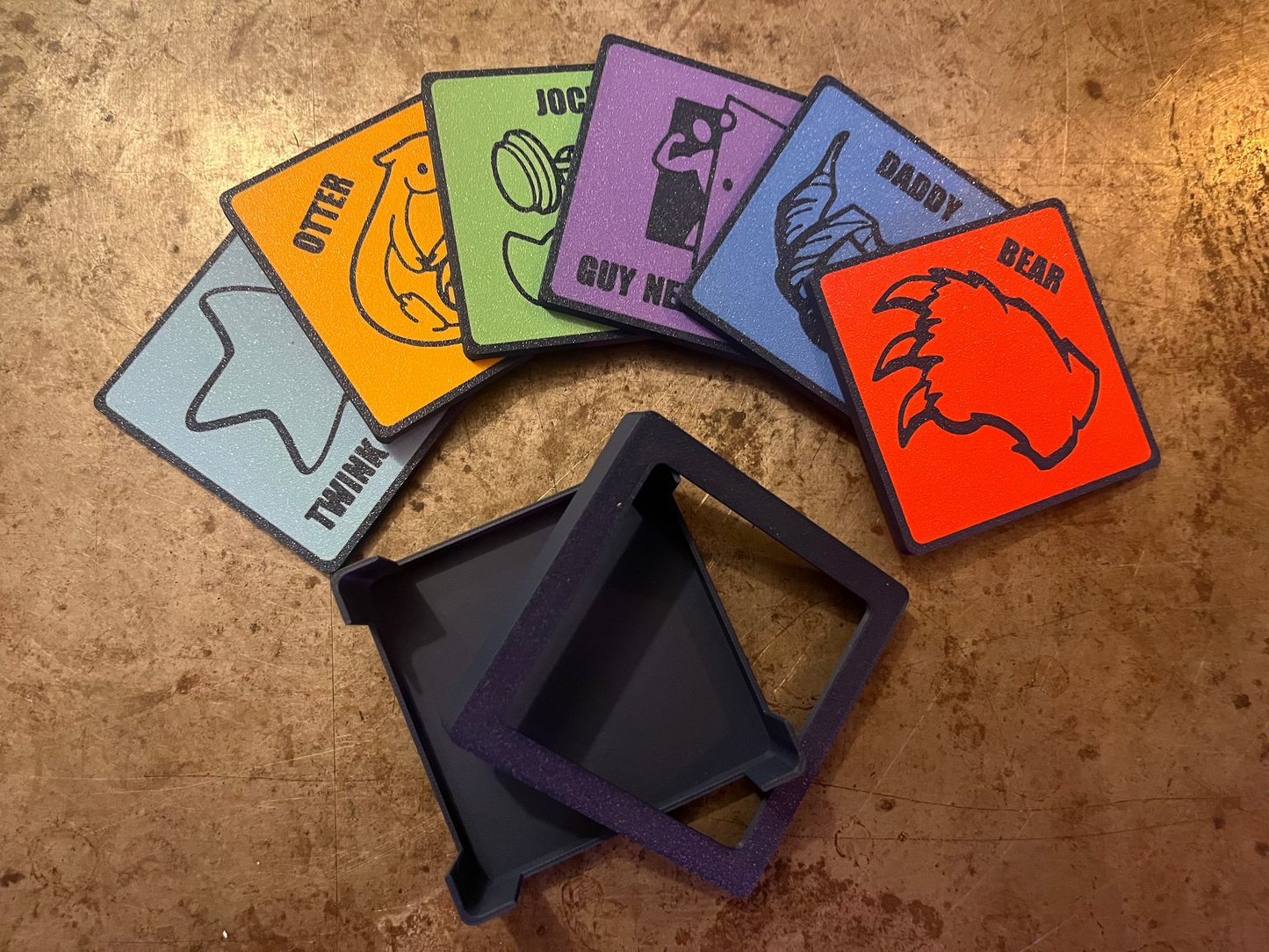 Set of colorful coasters with various designs on a textured surface